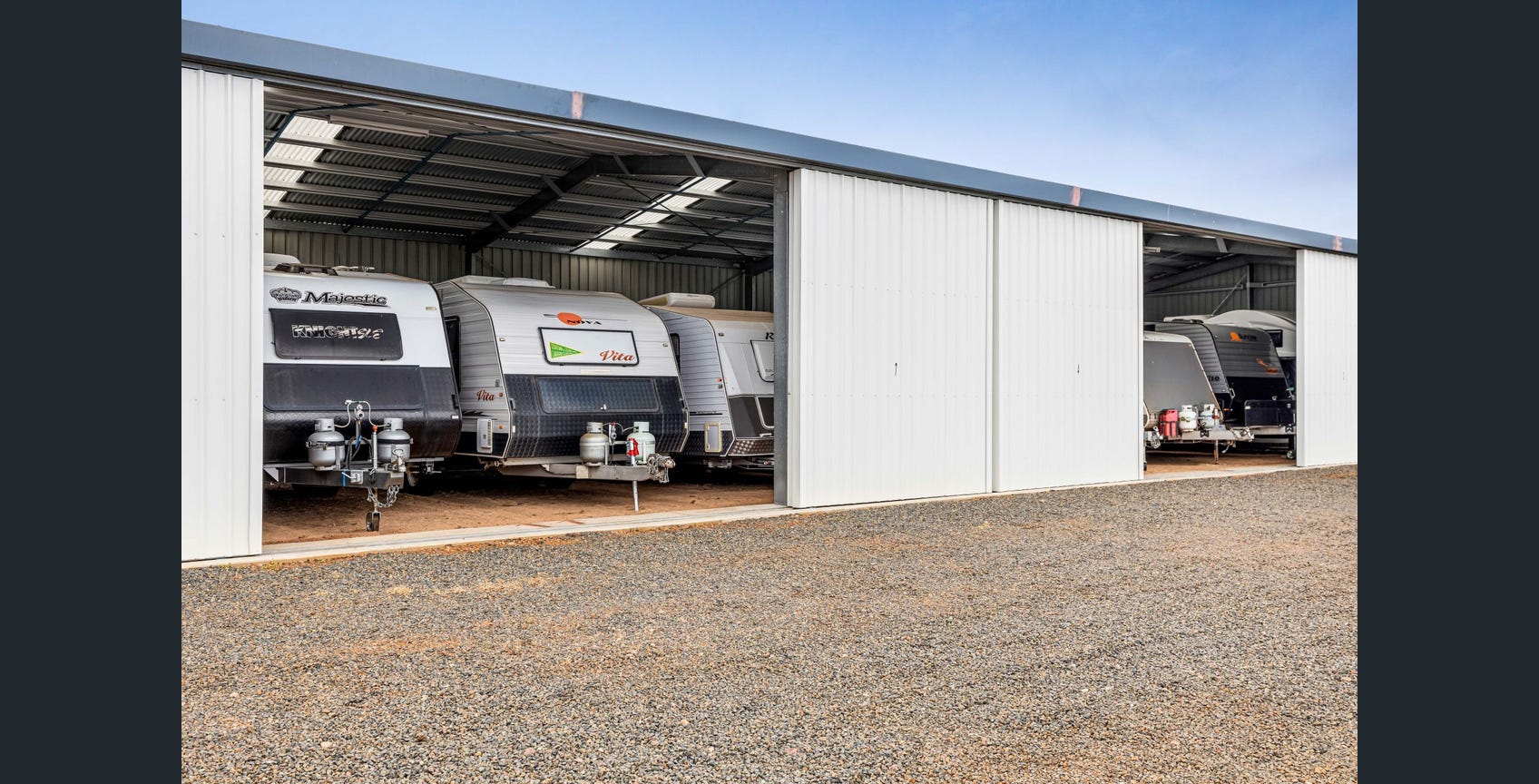 Covered caravan storage bays at Eastern Downs Storage and Stopover